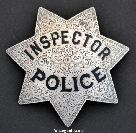 Sacramento Police Inspector badge made of sterling silver by the Ed Jones Co. Oakland, CAL and worn by Howard Sitton, circa 1920.