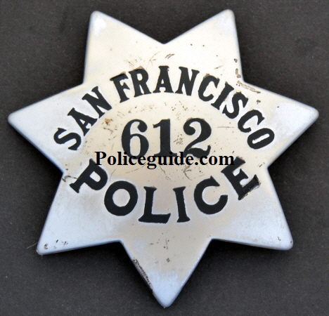 San Francisco Police Officer John Bacigalupi wearing badge #612, was appointed 8-8-21.  Made by Irvine & Jachens.  9-1-21.  Sterling.