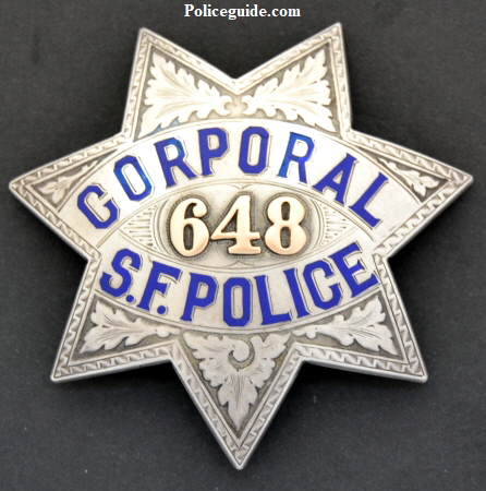 San Francisco Police Corporal badge #648, made by Irvine & Jachens. Sterling.  Issued to  Archie E. Schmidt who was promoted to Corporal on Jan. 1, 1926 and was first  appointed  to the force April 13, 1914.  Presentation on reverse reads:  From Two Dear Friends.  