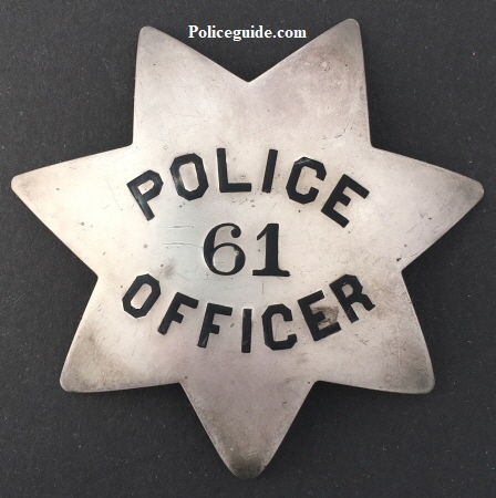 San Francisco Police badge #61 issued to George H. Graham who was appointed on March 22, 1892.  Sterling silver, T-pin back.