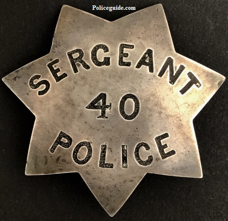 Philip Edward Fraher�s San Francisco Police officer and Sergeant  badge #40.   This badge was first used as a police officer badge and when the Fraher was promoted to Sergeant the badge was reversed and restamped.  