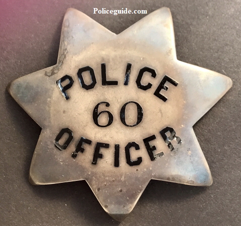 San Francisco Police badge #60 issued to John P. Herlihy who was appointed on Dec. 2, 1895.  Sterling silver, T-pin back.