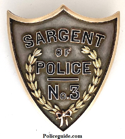 Sargent (German Spelling) of Police No. 3 St. Louis, MO Police Dept.  Made of sterling & gold.  Presented to Sgt. Thomas A. Shipp.