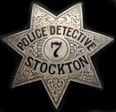    A perfect example of the �jewelers art� this hand engraved Stockton police detective star #7 is made of sterling silver and hallmarked Ed Jones Co. Oakland.  Circa 1925.