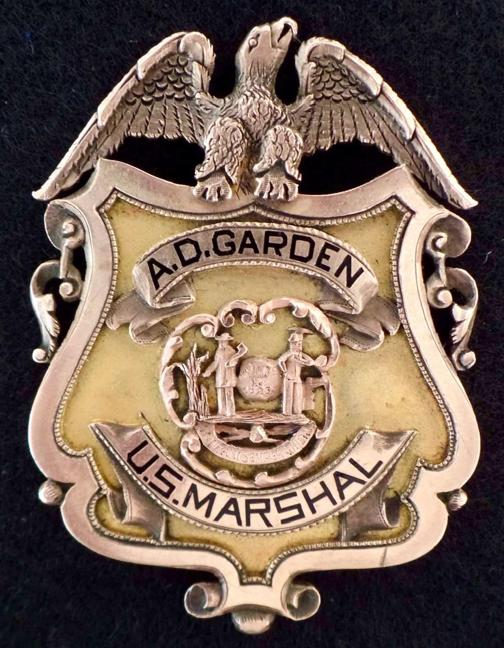 United States Marshal  A.D. Garden badge.  Presented by E. L. Nash & E. L. Priddie 1895.  14k gold.