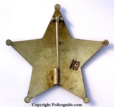 Obverse of U. S. Deputy Marshal badge from Hawaii, circa 1902.  Hallmarked:  Made in Honolulu HC sterling.  T-pin and Tube catch.